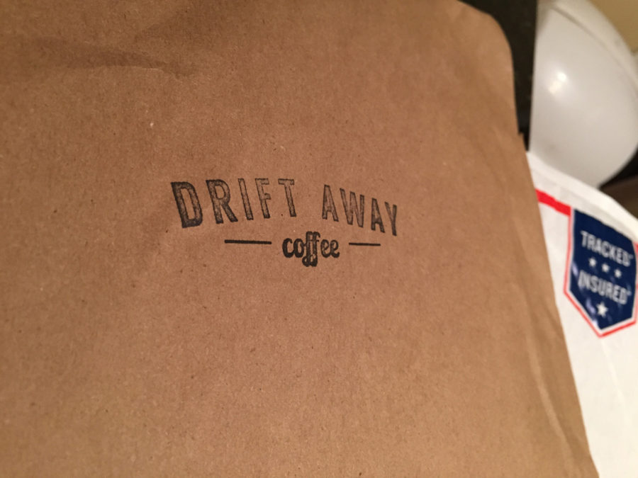 The handsome, brown paper packaging with the Driftaway Coffee logo stamped on the front