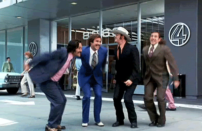 Ron Burgundy and the Channel 4 News Team jumping for joy