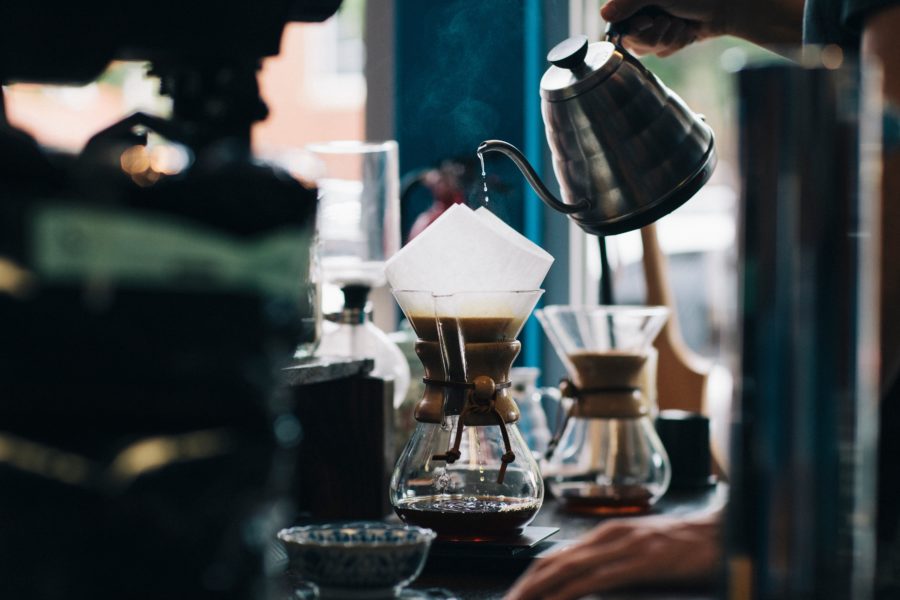 A Chemex pour-over being prepared in a coffee shop