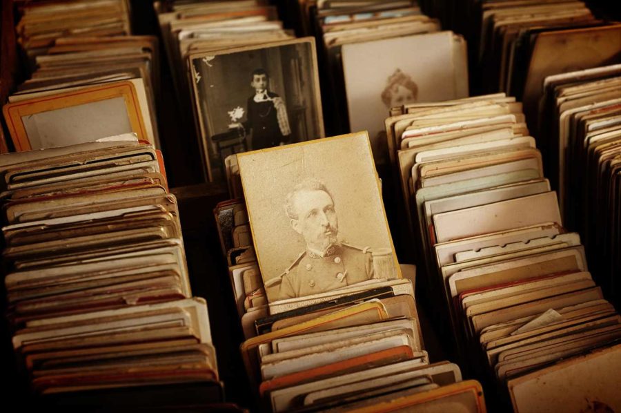 Stacks of vintage, sepia-toned photographs