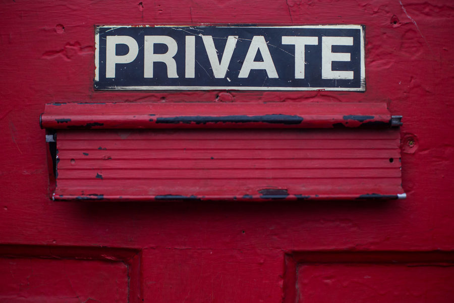 A mail slot, just below a bold sign reading "Private"
