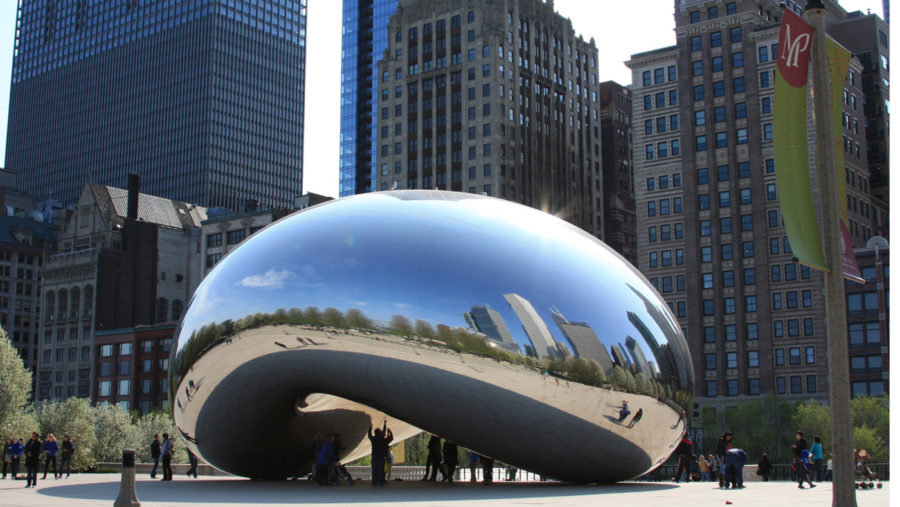 Cloud Gate (a.k.a. "The Bean"), surrounded by tourists in Chicago, IL.
